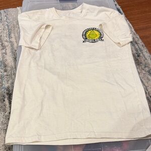 Cream Graphic Tee with Yellow Sun Design The Grinch
